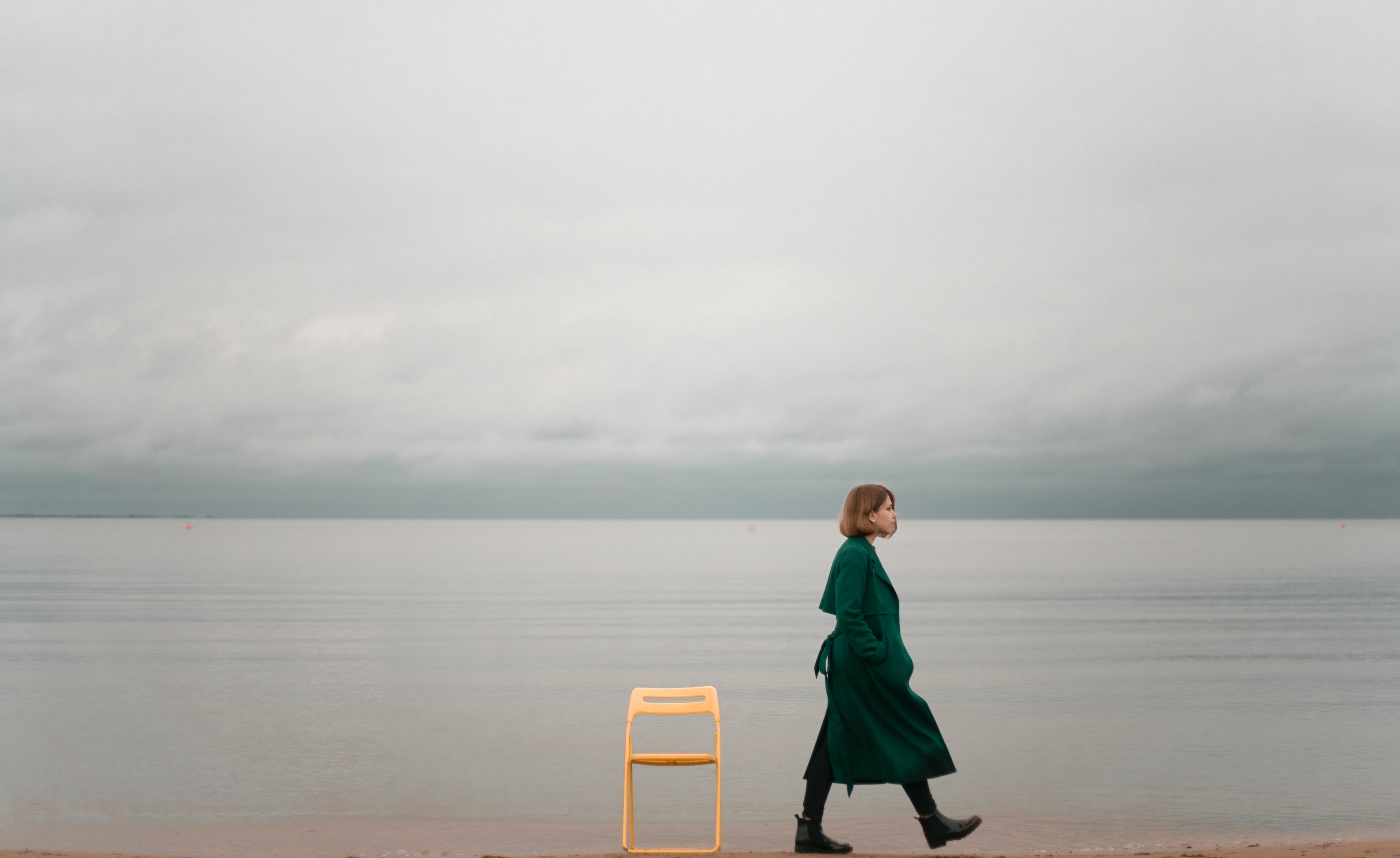 Photo of woman walking alone on beach